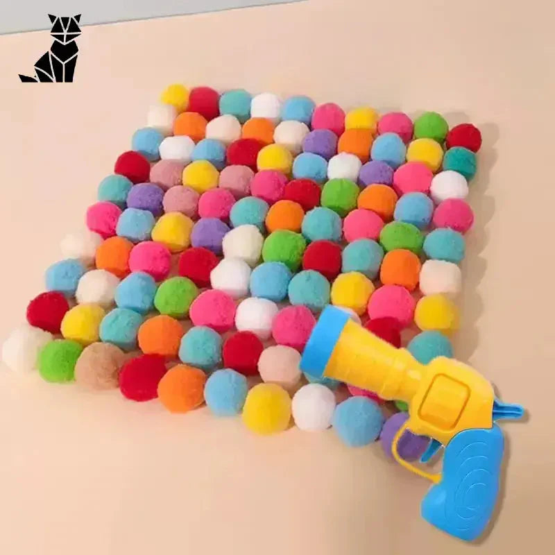 Mini lanceur de pompons colorés pour chats - pistolet à chat avec boules de pompons