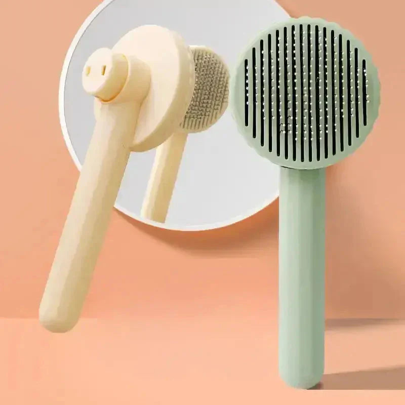 Peigne à chat pour enlever en douceur les poils morts, design ergonomique sur fond rose